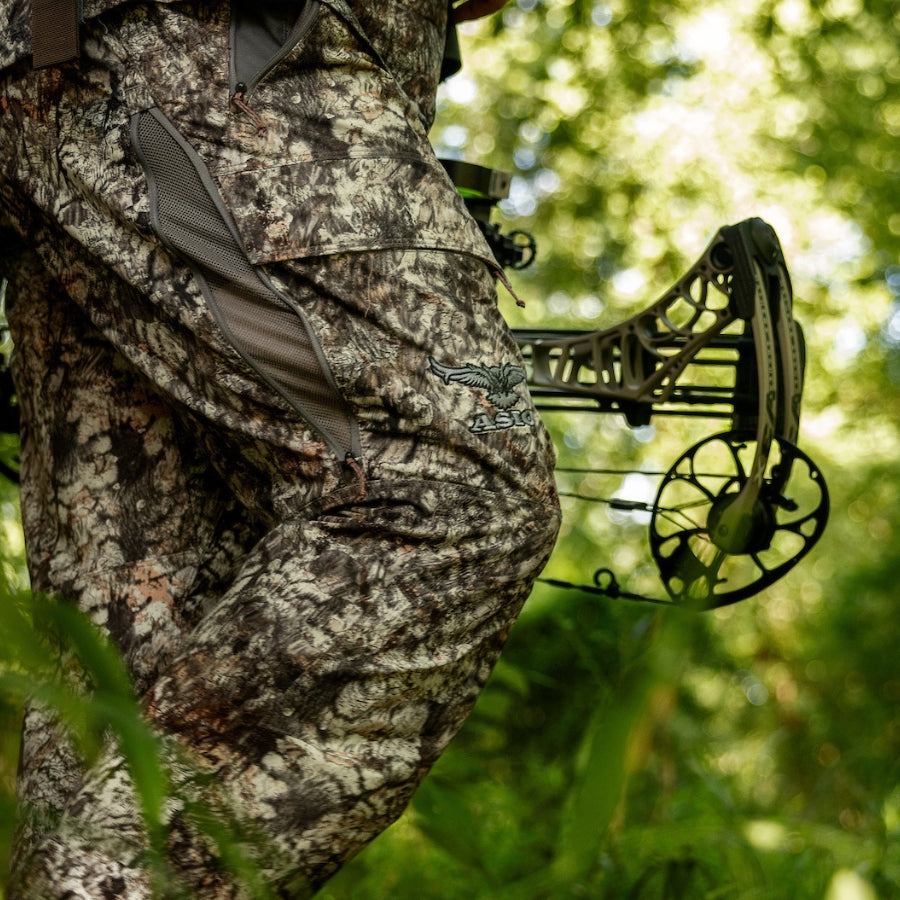 hunter walking in lightweight pants by asio gear in raptor camo