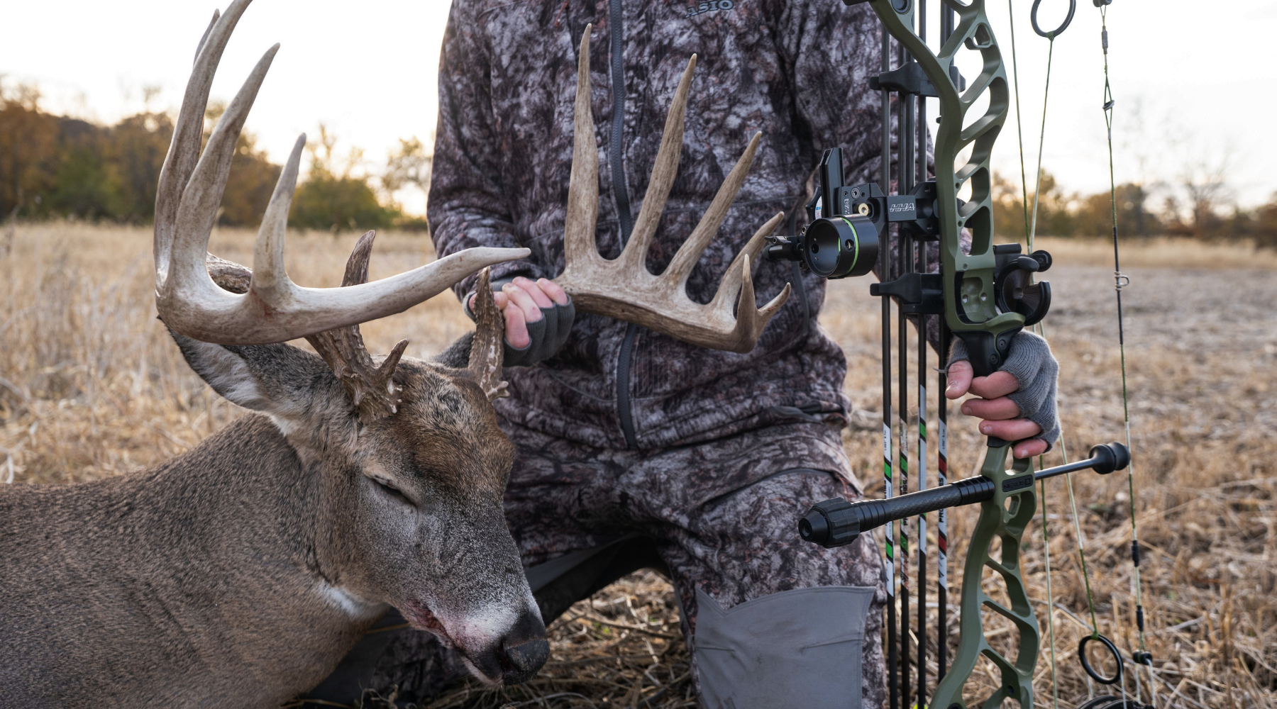 hunter glassing a valley wearing asio raptor camo