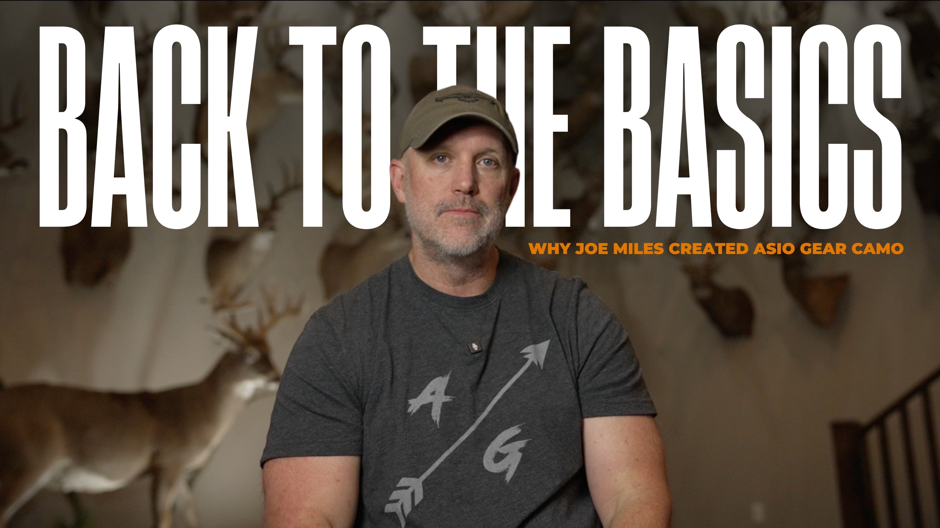 Joe Miles sits in front of mounted whitetail trophies with bold text "Back to the Basics" promoting the origin story of ASIO Gear camo in a video thumbnail.