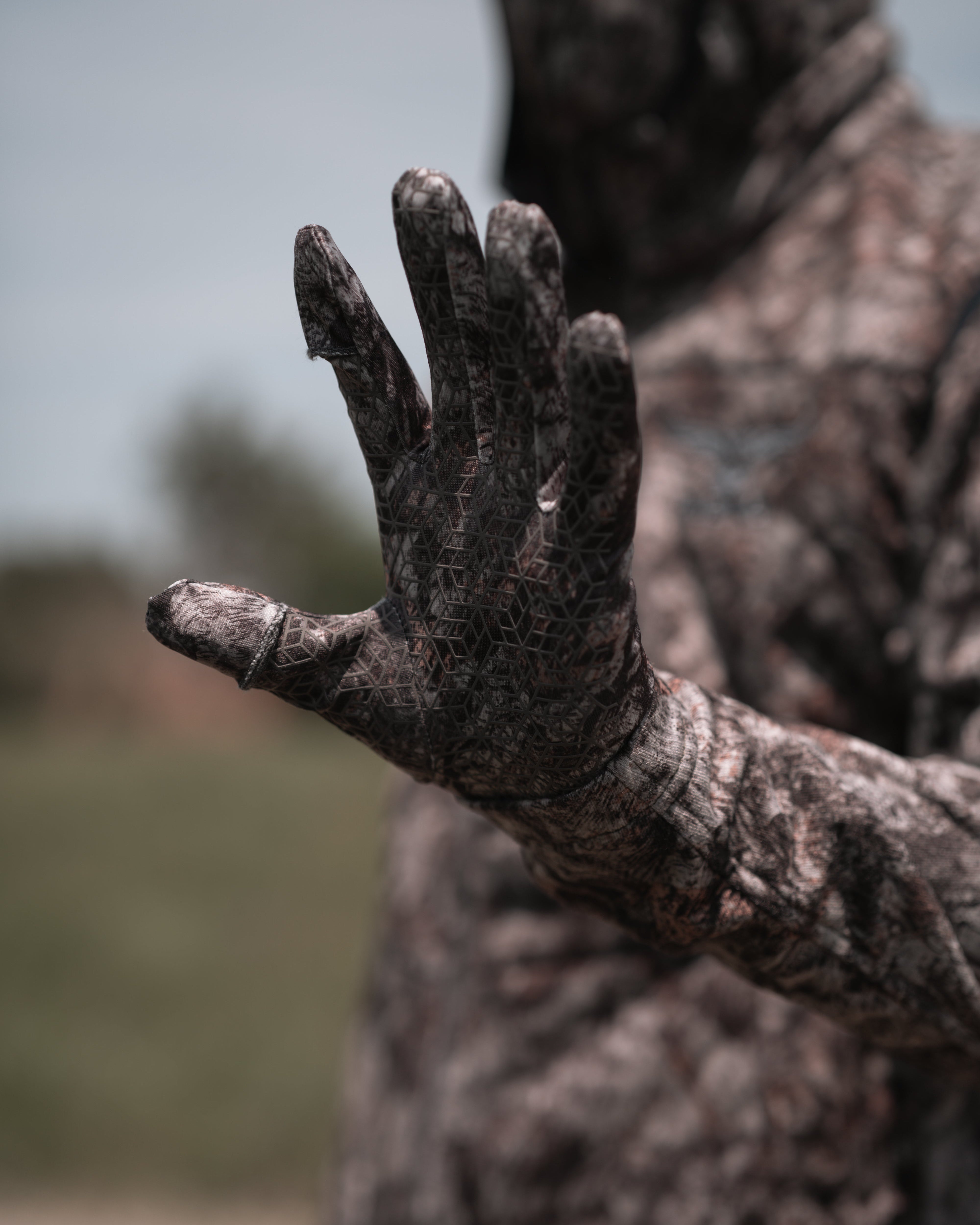 Palm detail of ASIO Gear lightweight stretch glove in RAPTOR camo showing silicone grid for enhanced grip